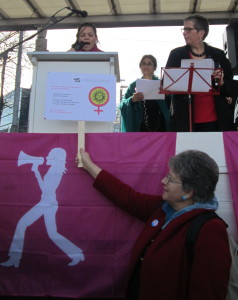 "ADF-SVF suisse addressing the audience: Charlotte Mosquera reading the statement and Martine Gagnebin, president of ADF-SVF suisse, holding up our logo" 