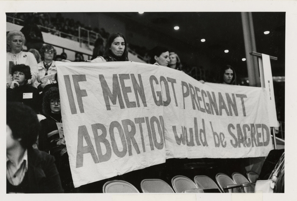 photograph-of-women-holding-banner-if-men-got-pregnant-abortion-would-be-sacred