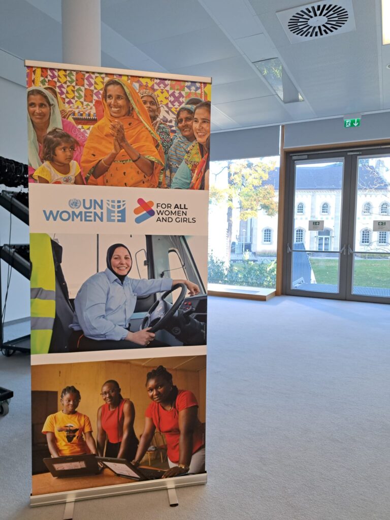 The image provided displays a promotional banner for UN Women, the United Nations entity dedicated to gender equality and the empowerment of women and girls. The banner uses the slogan and campaign title "For ALL Women and Girls". The banner features three distinct images of women and girls from various cultural backgrounds and professions, illustrating the organization's global focus on women's rights and empowerment in different areas of life, such as economic empowerment (the woman in the bus/truck), and community engagement. The "For ALL Women and Girls" campaign is a global initiative by UN Women that calls for action to accelerate progress on gender equality, focusing on rights, equality, and empowerment, particularly in areas like freedom from violence, economic security, and equal decision-making power.